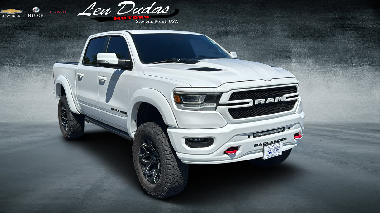 2022 RAM 1500 Laramie Crew Cab 4x4 5'7" Box in White — front three-quarter view