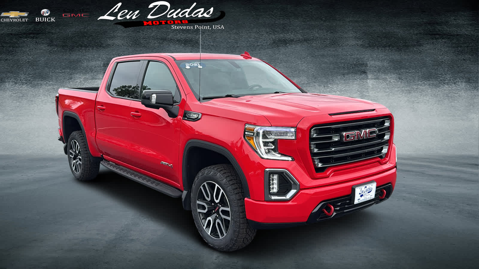 2021 GMC Sierra 1500 AT4 in Cardinal Red — front three-quarter view
