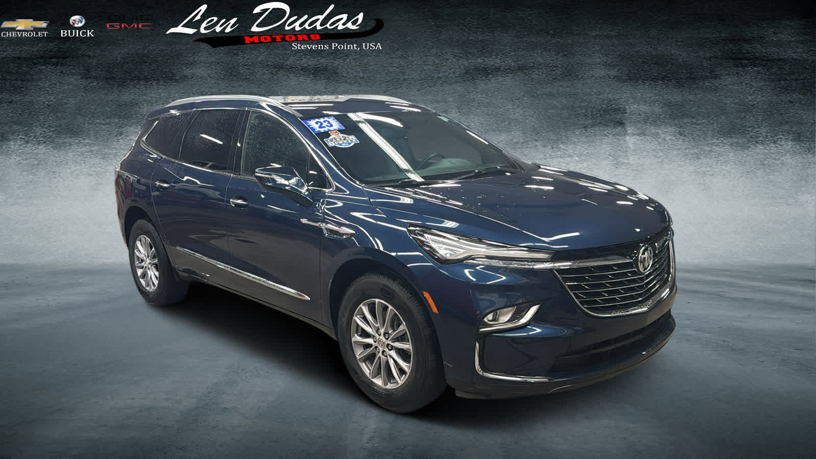 2023 Buick Enclave Essence in Emperor Blue Metallic — front three-quarter view