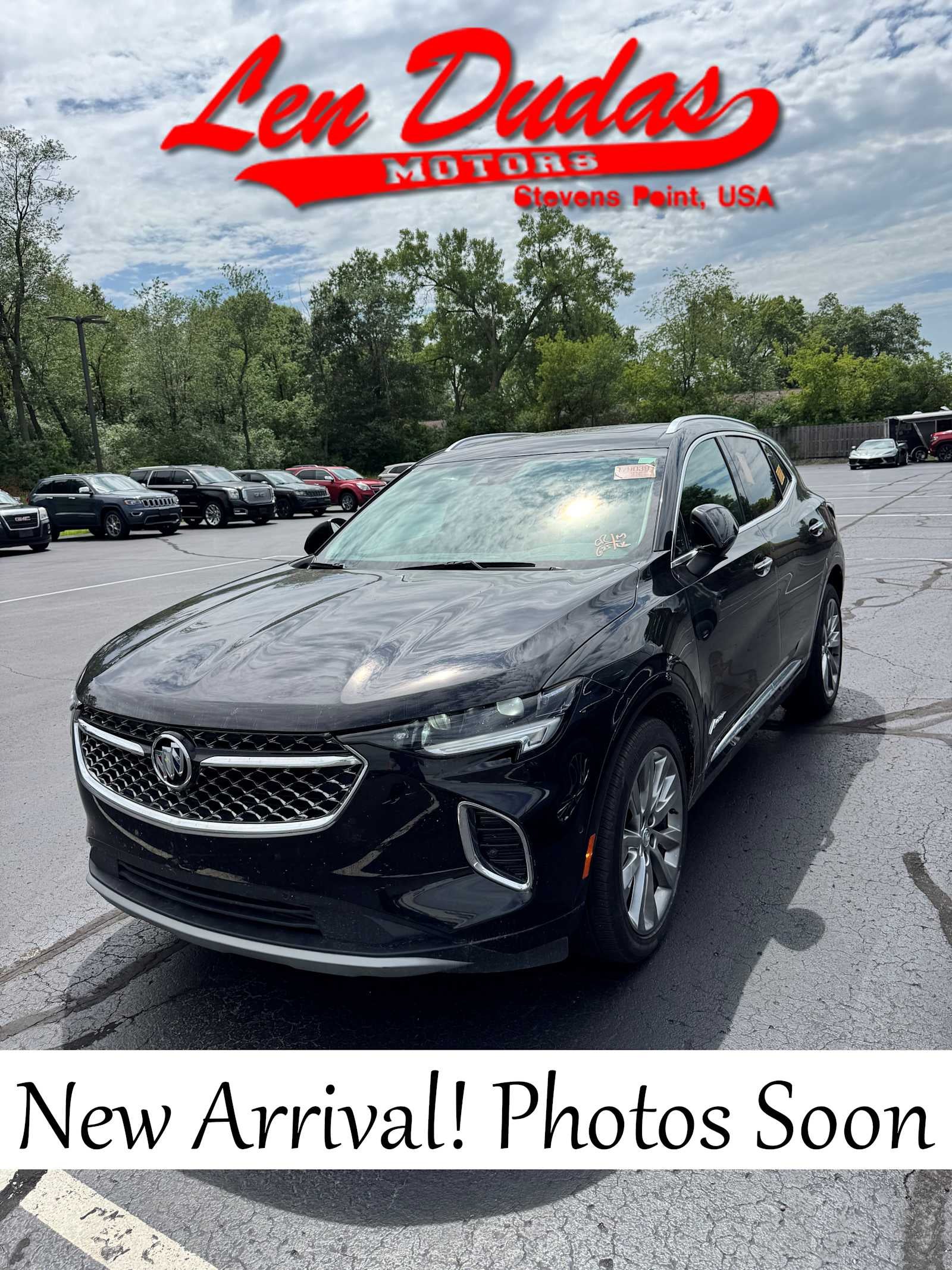 2023 Buick Envision Avenir in Ebony Twilight Metallic — front three-quarter view